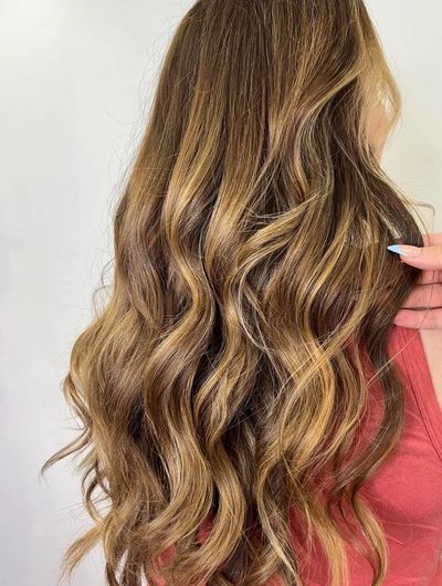Long wavy blonde hair, back view.