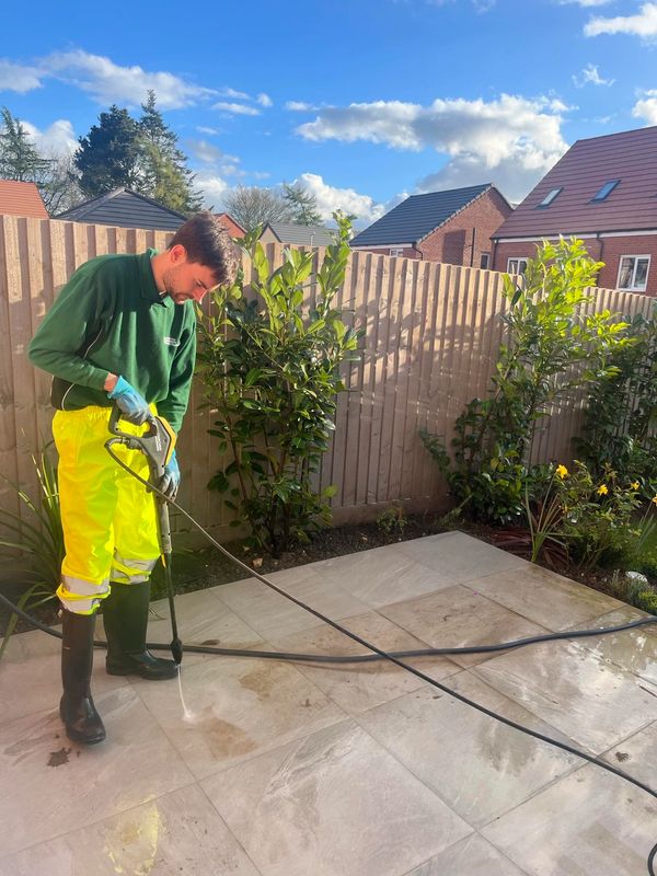 Norfolk Grounds Maintenance pressure washing hard surfaces for a commercial customer in Swaffham.