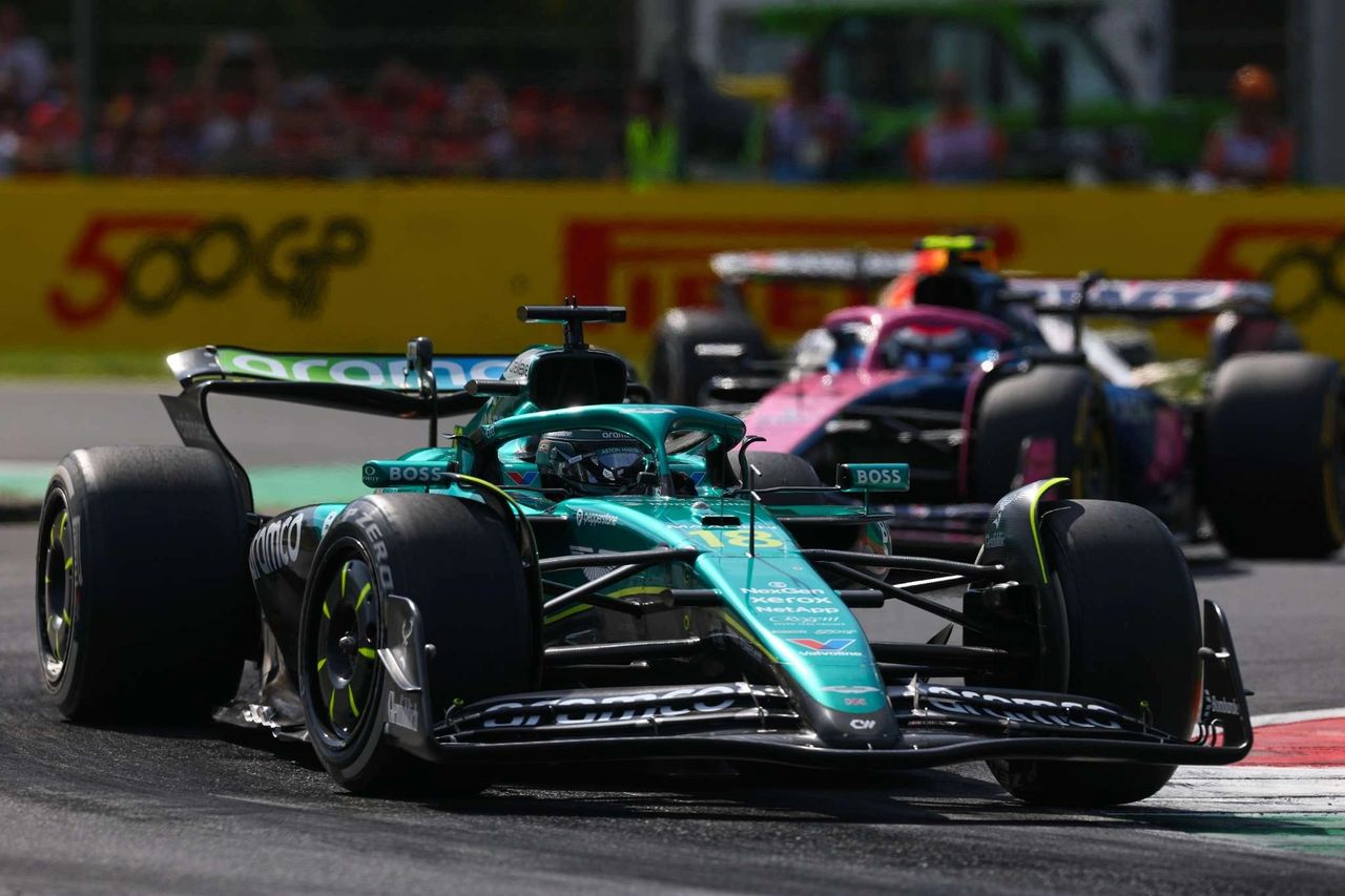 Aston Martin F1 car driven by Lance Stroll leads an Alpine during the 2025 Formula 1 Italian Grand Prix at Monza.