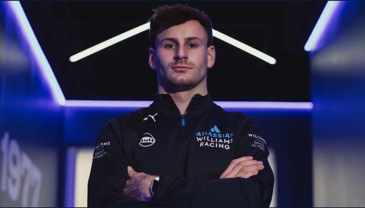 Victor Martins, member of the Williams Driver Academy, poses in team kit ahead of the 2025 Formula 2 Silverstone round. The French driver claimed pole position for the Feature Race with a time of 1:39.731. (Photo: Williams Racing / FIA Formula 2)