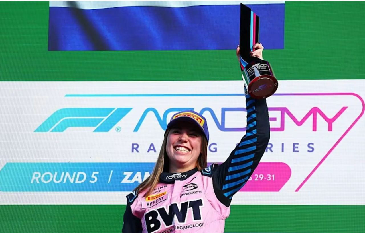 Nina Gademan lifts the winner’s trophy after securing her first F1 Academy victory at Zandvoort on her 22nd birthday, Alpine driver on top of the podium. Nina Gademan lifts the winner’s trophy after securing her first F1 Academy victory at Zandvoort on her 22nd birthday, Alpine driver on top of the podium.