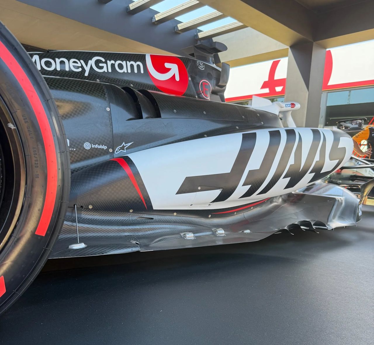 Close-up of the Haas VF-25’s sidepod and floor design at the 2025 Goodwood Festival of Speed, showcasing intricate aero surfaces and updated bodywork. Close-up of the Haas VF-25’s sidepod and floor design at the 2025 Goodwood Festival of Speed, showcasing intricate aero surfaces and updated bodywork.