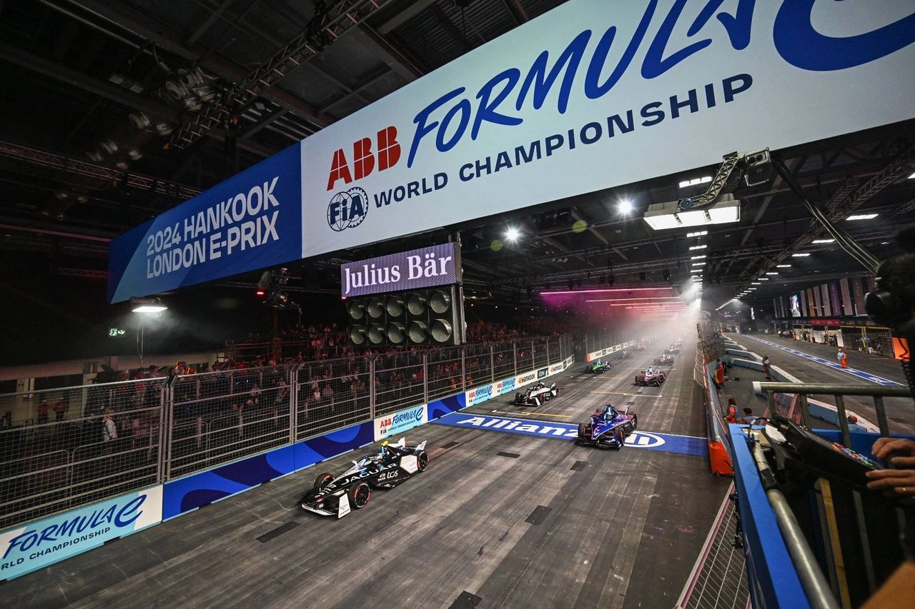 Photo from the 2024 Hankook London E-Prix showing Formula E cars launching from the start line inside ExCeL London. The race takes place on a unique indoor–outdoor circuit and serves as the season finale for the ABB FIA Formula E World Championship. Photo credit: Formula E. Photo from the 2024 Hankook London E-Prix showing Formula E cars launching from the start line inside ExCeL London. The race takes place on a unique indoor–outdoor circuit and serves as the season finale for the ABB FIA Formula E World Championship. Photo credit: Formula E.