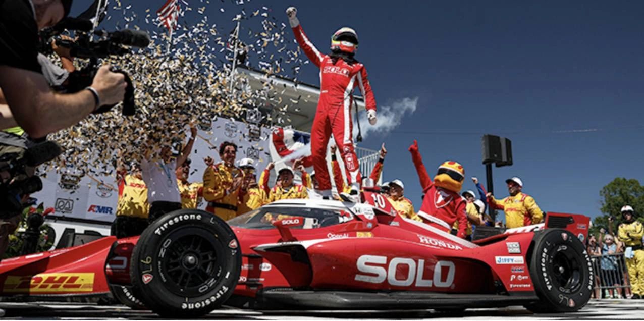 Alex Palou wins at Road America 2025 — INDYCAR victory celebration with Chip Ganassi Racing, confetti, and SOLO Cup Honda.