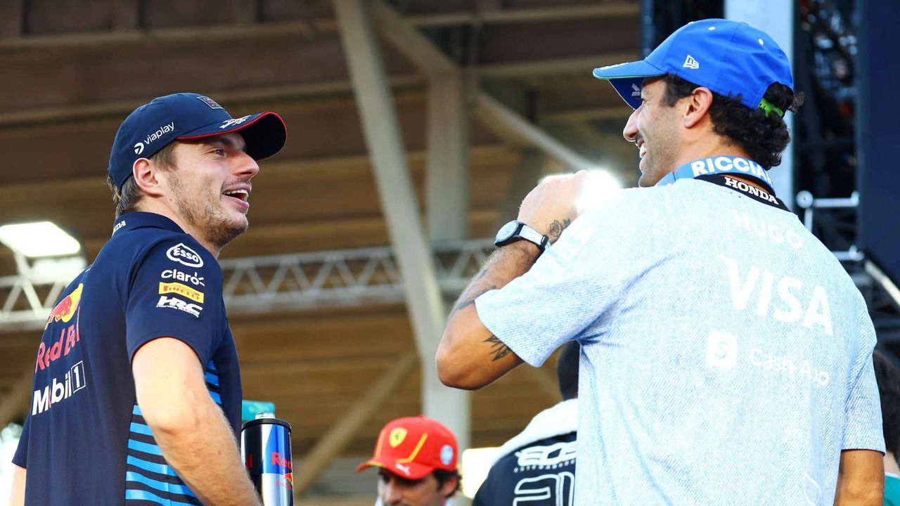 Daniel Ricciardo and Max Verstappen share a moment at the 2024 Singapore Grand Prix. Captured during Ricciardo’s final Formula 1 race weekend, the photo shows both drivers in team kit, highlighting Ricciardo’s farewell to the grid.
