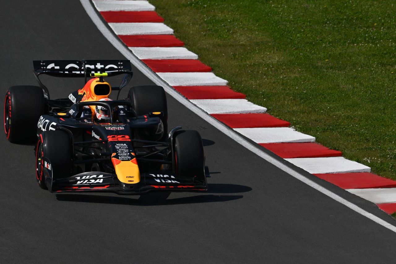 Yuki Tsunoda driving the #22 Red Bull car at Circuit Gilles Villeneuve during FP3 of the 2025 Canadian Grand Prix, approaching the red and white kerbs. Yuki Tsunoda driving the #22 Red Bull car at Circuit Gilles Villeneuve during FP3 of the 2025 Canadian Grand Prix, approaching the red and white kerbs.