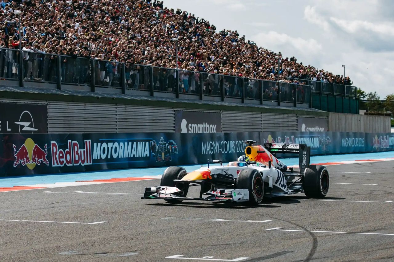 Isack Hadjar drives the Red Bull RB7 in VCARB livery at Magny-Cours during Red Bull Motormania 2025