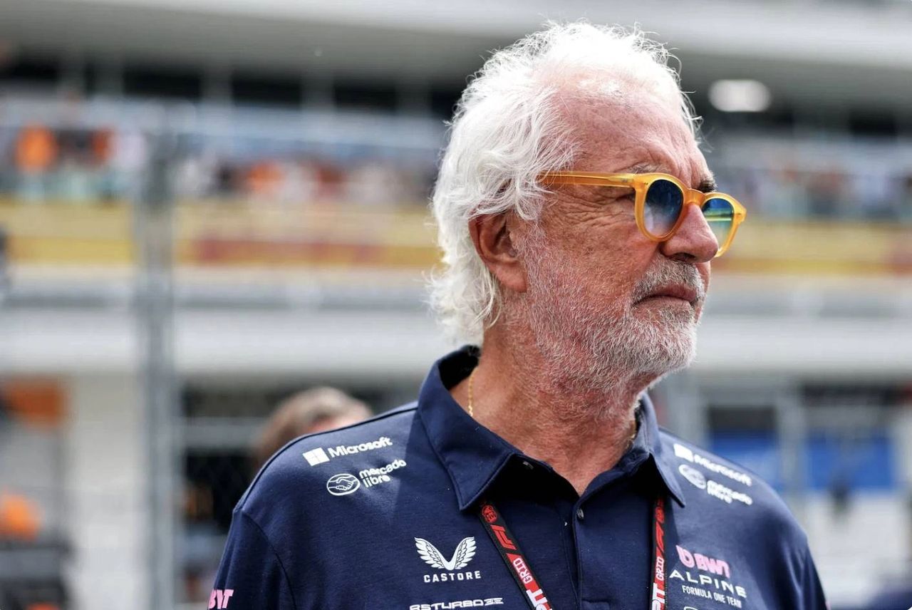 Flavio Briatore wearing Alpine F1 team gear in the paddock at a Grand Prix weekend in 2025. Recently appointed as senior advisor, Briatore’s return marks a key moment in Alpine’s ongoing restructuring ahead of the 2026 Formula 1 season.