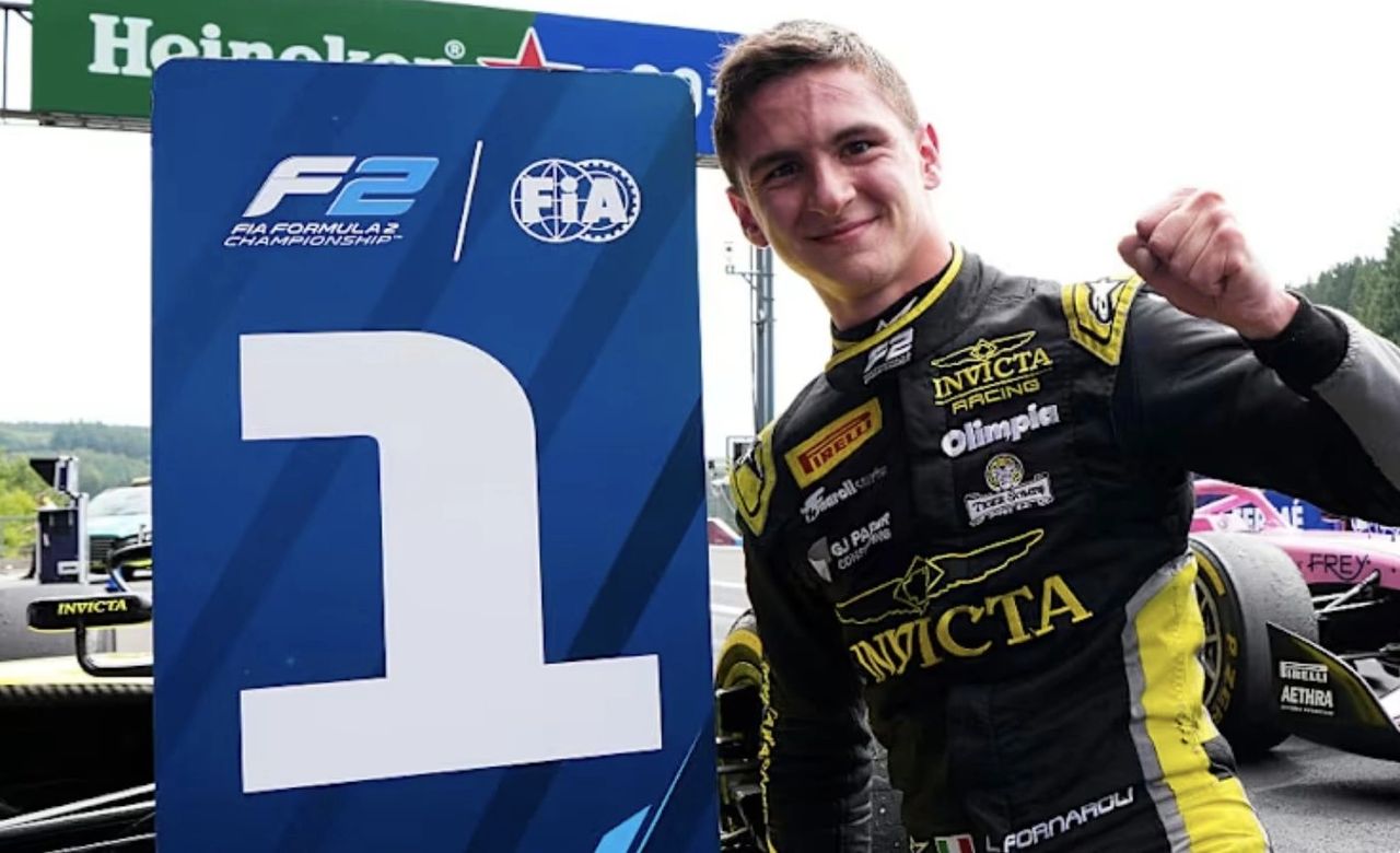 Leonardo Fornaroli celebrates FIA Formula 2 Sprint Race victory for Invicta Racing at Spa 2025, raising his fist next to the P1 board.