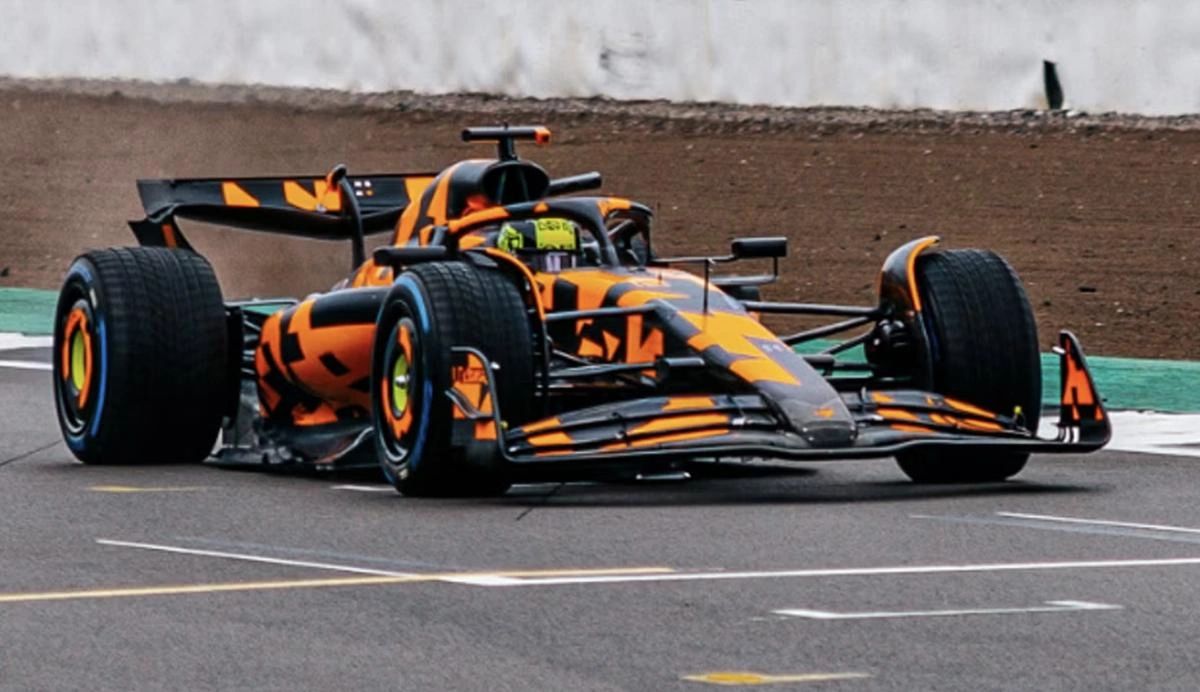 McLaren F1 car in orange-and-black camouflage livery during 2025 pre-season testing, focusing on aerodynamic evaluation.