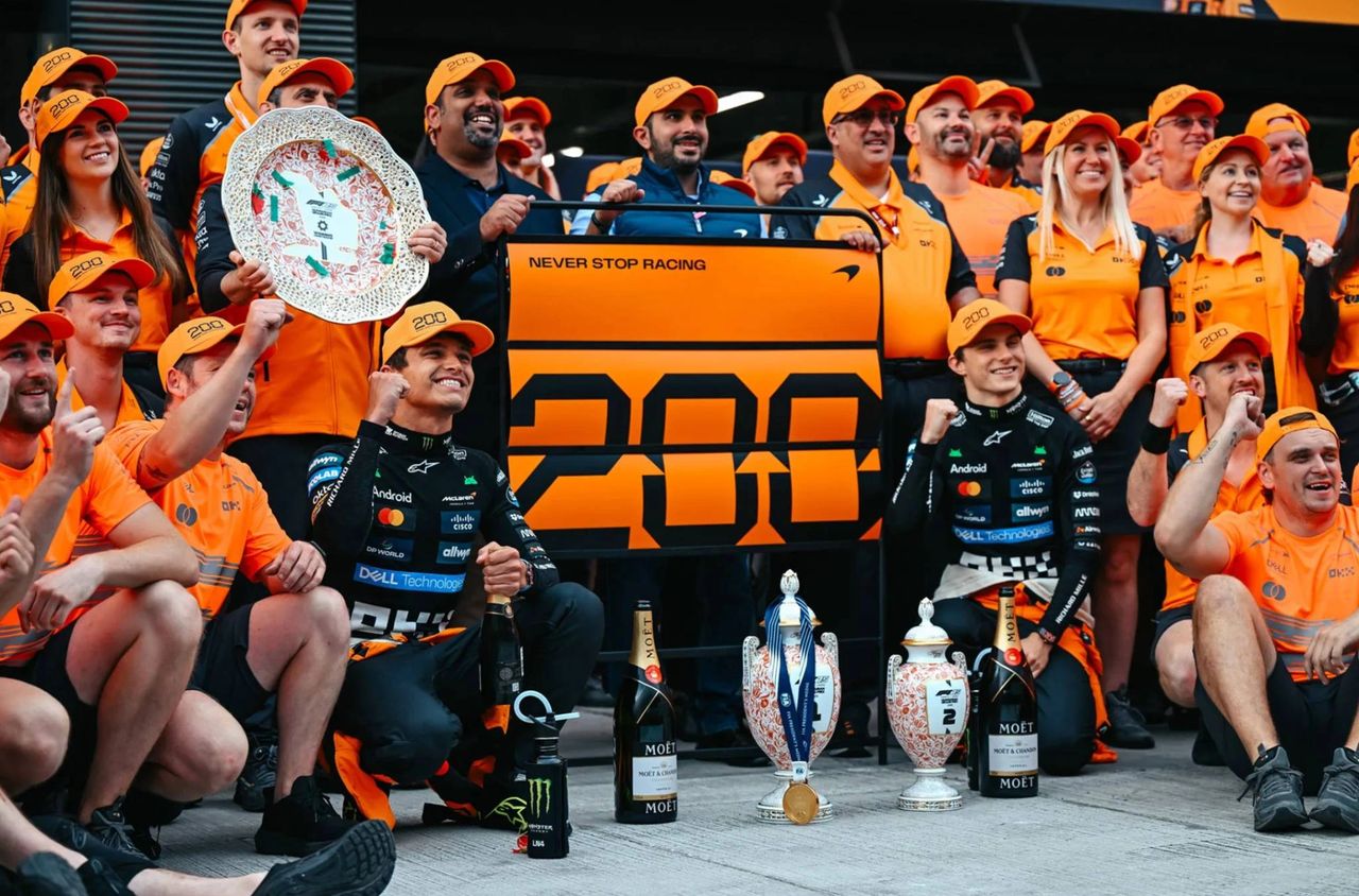 McLaren Formula 1 team photo celebrating their 200th Grand Prix win at the 2025 Hungarian Grand Prix, featuring drivers Lando Norris and Oscar Piastri, team personnel in orange, and celebratory trophies. Photo courtesy of McLaren. McLaren Formula 1 team photo celebrating their 200th Grand Prix win at the 2025 Hungarian Grand Prix, featuring drivers Lando Norris and Oscar Piastri, team personnel in orange, and celebratory trophies. Photo courtesy of McLaren.