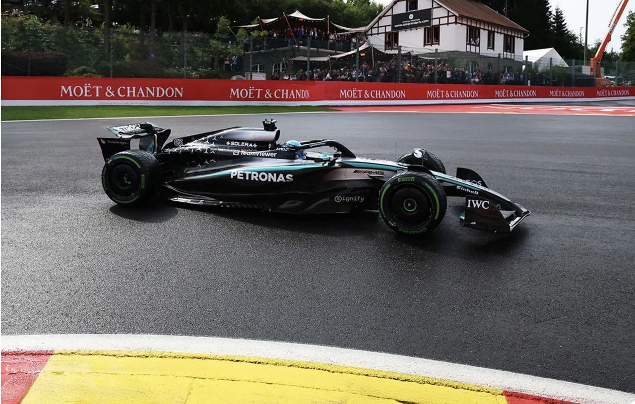 George Russell driving the Mercedes W16 Formula 1 car at Spa during the 2025 Belgian Grand Prix in wet conditions