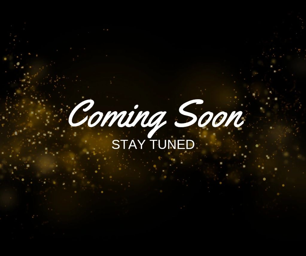 Elegant 'Coming Soon' announcement with golden sparkles on black background.