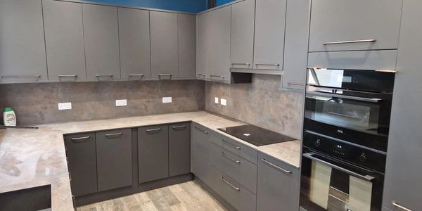 Grey Kitchen unit installation by AJ Joinery