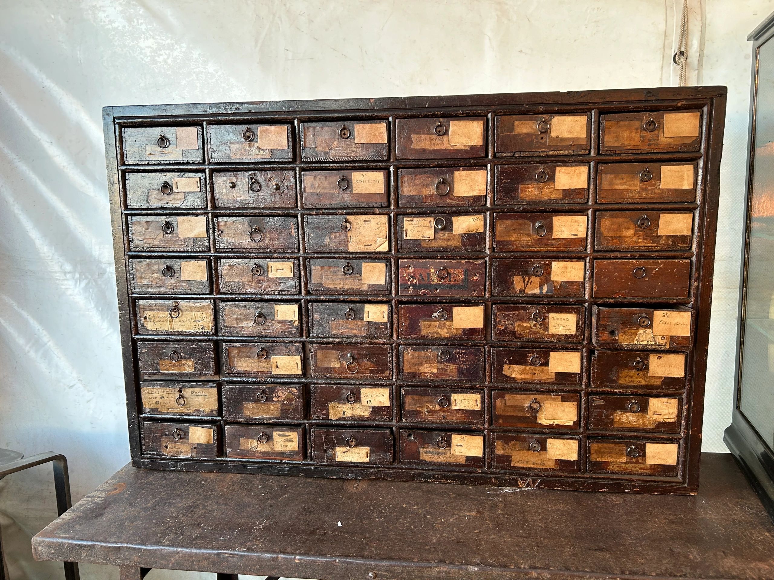 Antique Haberdashery cabinet great condition for age with layers of labels added over the years 