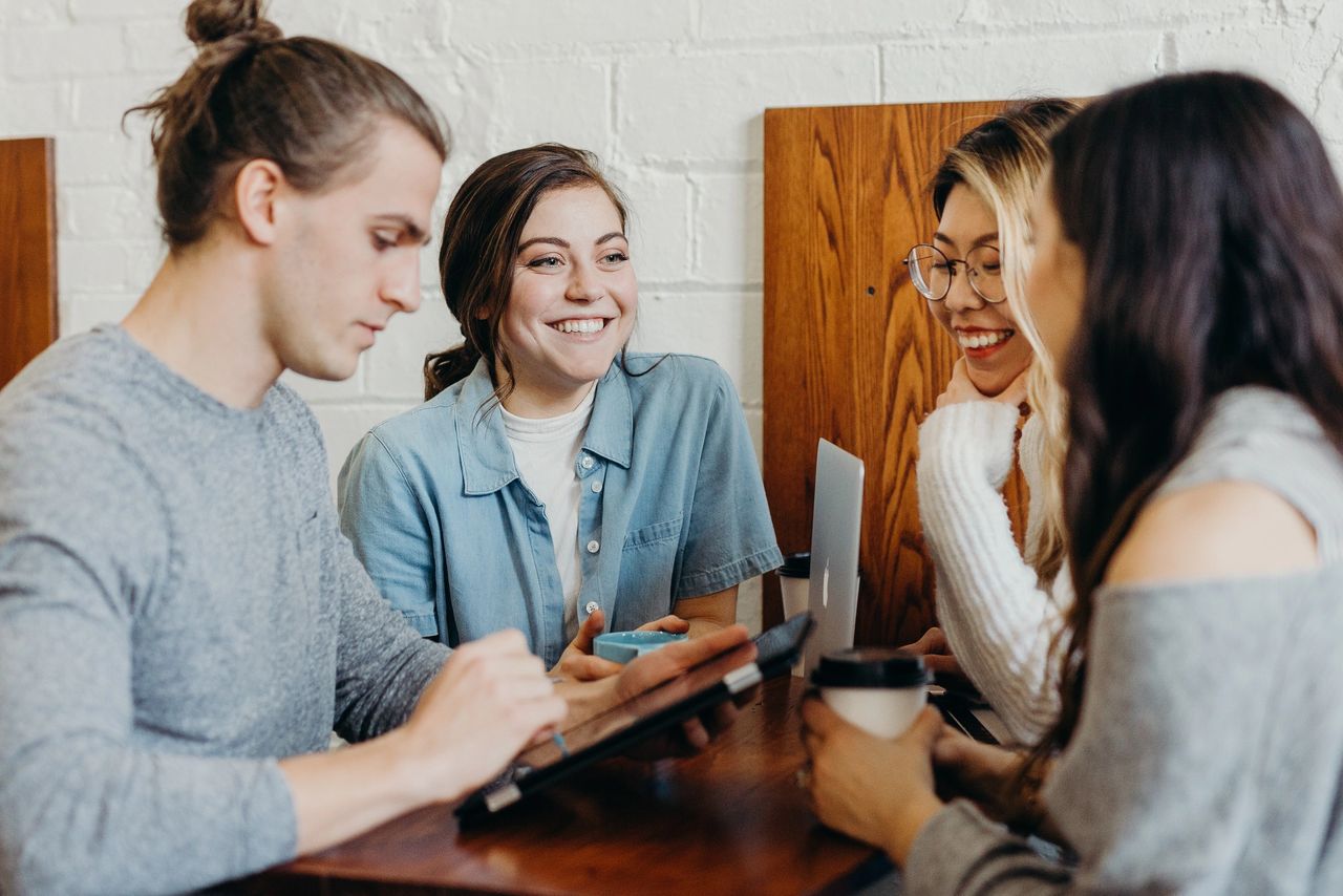 group of people working in a cafe