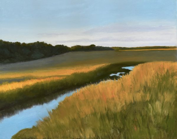 Peaceful countryside with a winding river and golden fields under a clear sky.