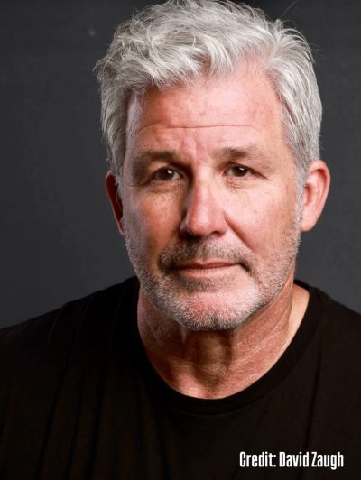 Portrait of a middle-aged man with gray hair.