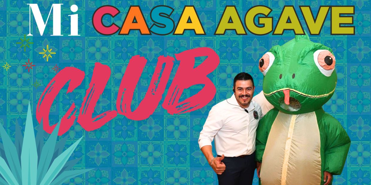 Man posing with a person in a frog costume at Mi Casa Agave Club.