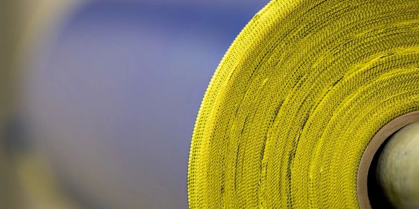 Close-up of yellow fabric roll.
