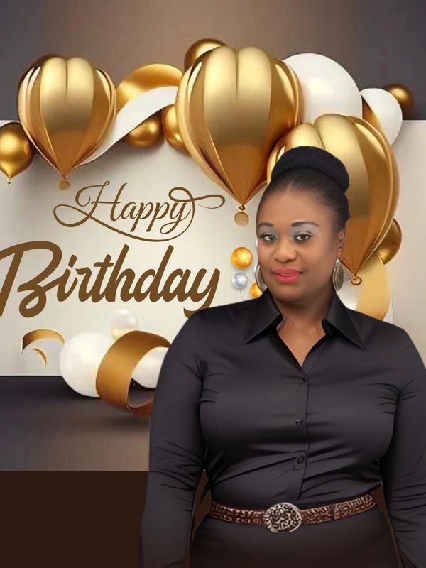 Woman smiling in front of a Happy Birthday backdrop with gold and white balloons.
