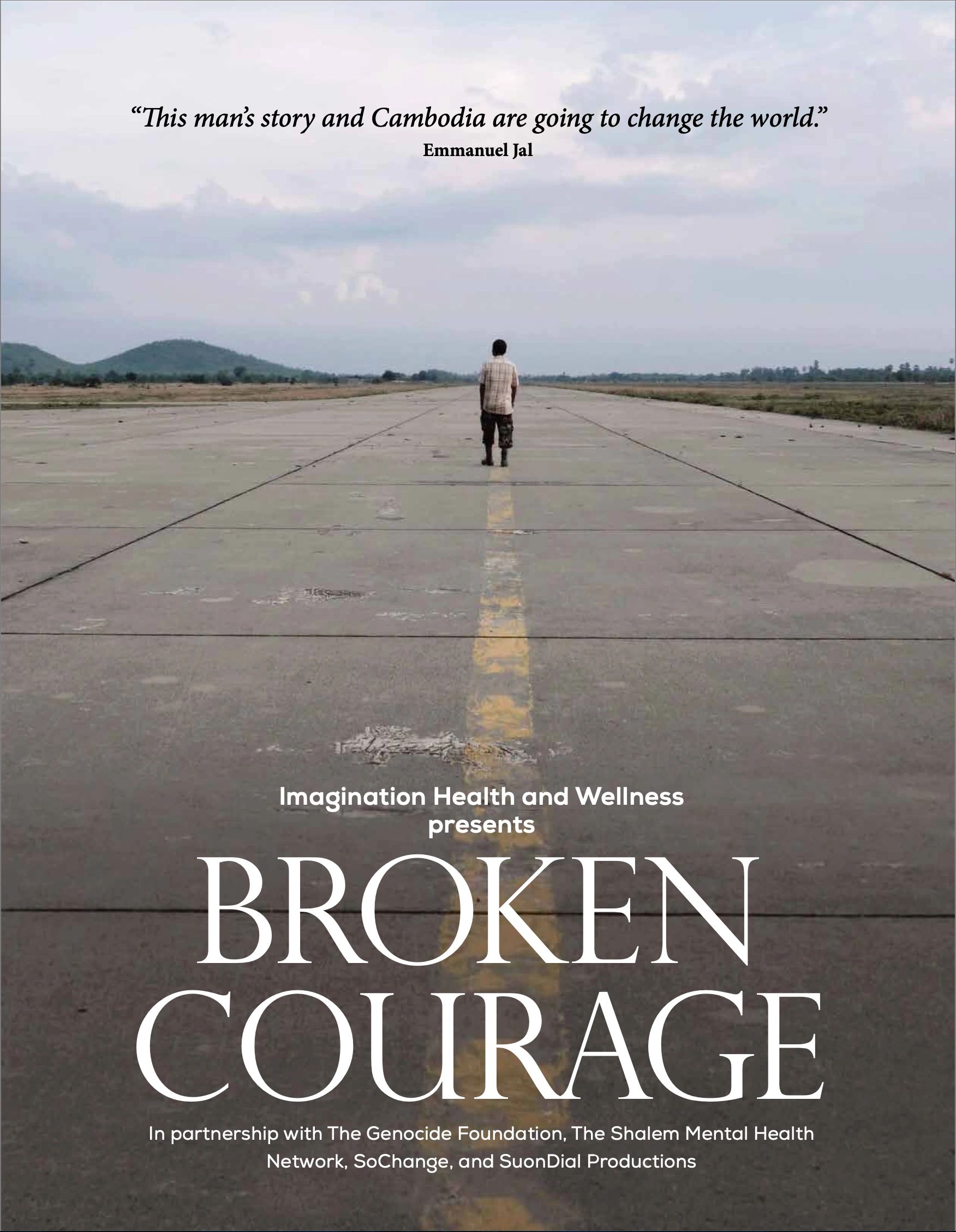 Man standing alone on an empty runway under a cloudy sky.