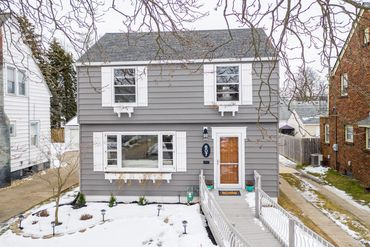 New roof, painted siding, railing, landscaping, custom made shutters and window boxes 