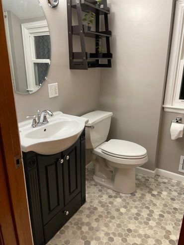 New flooring, vanity, sink, trim and paint