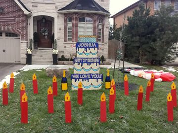 A 21st Happy Birthday lawn card from birthdaysignsations.ca showing a 6 foot tall sign and candles.