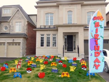 A display of lawn ornaments not accompanied with a lawn card.  There is also a birthday flag shown.