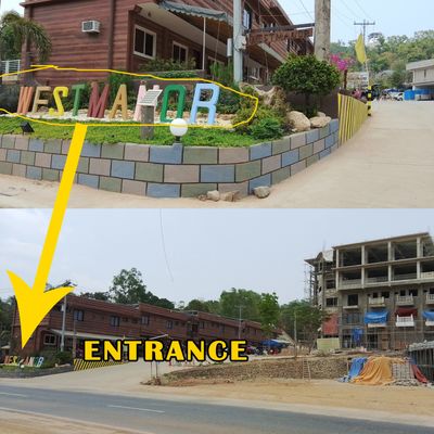 Entrance to the West Manor residential complex with a sign and ongoing construction nearby.