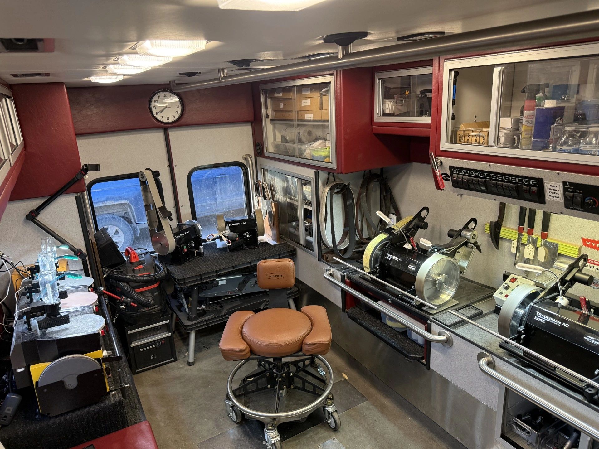 Interior of a well-organized mobile workshop with tools and machines.