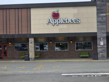 Exterior of an Applebee's restaurant with its logo and entrance visible.