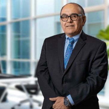 Professional man in suit standing in office.