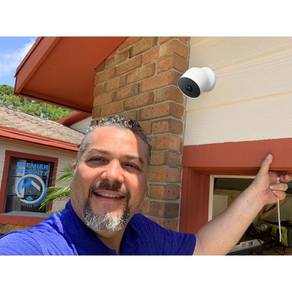 Premier Security technician installing a Nest, Ring or Blink camera for a PSL homeowner