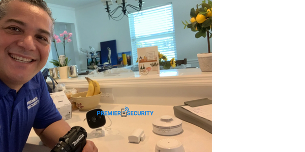 Premier Security team installing alarm sensors in Port St. Lucie home