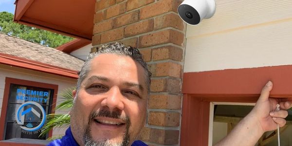 Premier Security technician installing CCTV camera in Port St. Lucie