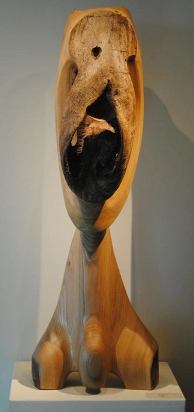 Barbara Hepworth-esque abstract wood sculpture, with smooth curves and a central void