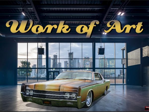 Classic car showcased in a modern gallery with 'Work of Art' title.