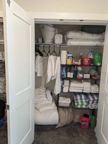 Closet storage, closet system, linen closet and decluttered.
