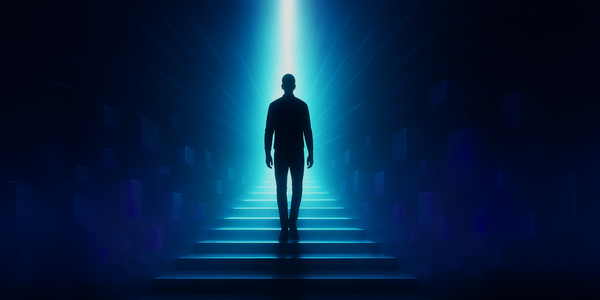 Silhouette of a person walking up illuminated stairs into a bright blue light.