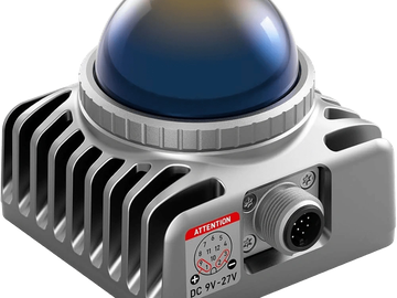 Compact electronic device with a blue dome and cooling fins.