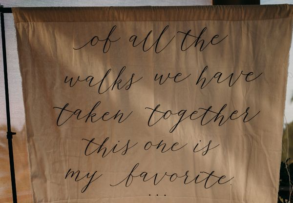 A rustic fabric sign with a quote