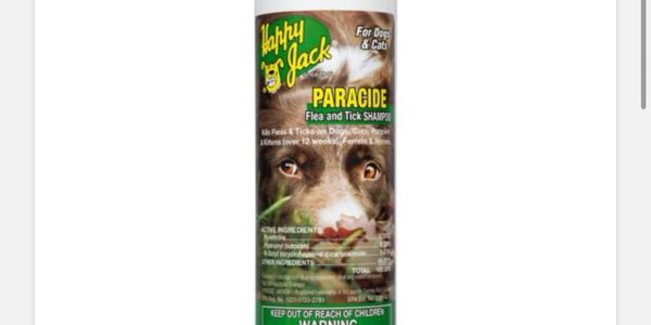 Happy Jack Paradide flea and tick shampoo for dogs and cats with a dog image.