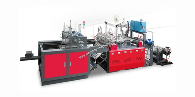 Industrial red and black machinery, likely for manufacturing or packaging.