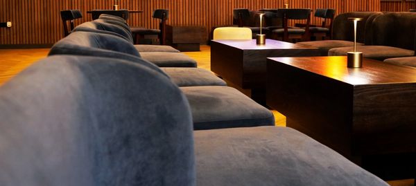 Comfy blue velor Sofas and low tables, showcasing the ambience of the suite