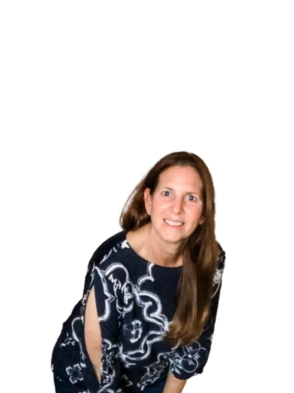 Smiling woman with long hair wearing a black and white patterned top.
