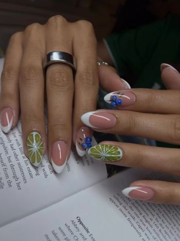Nails with floral and French tip designs.