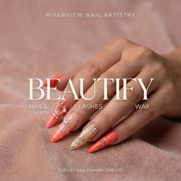 Stylish nails with intricate designs and embellishments.