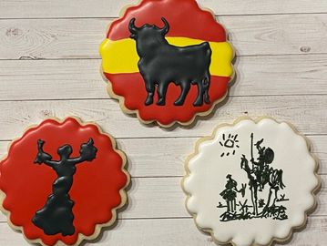 three round scalloped edge cookies with spanish theme - flamenco dancer, bull, picasso quijote